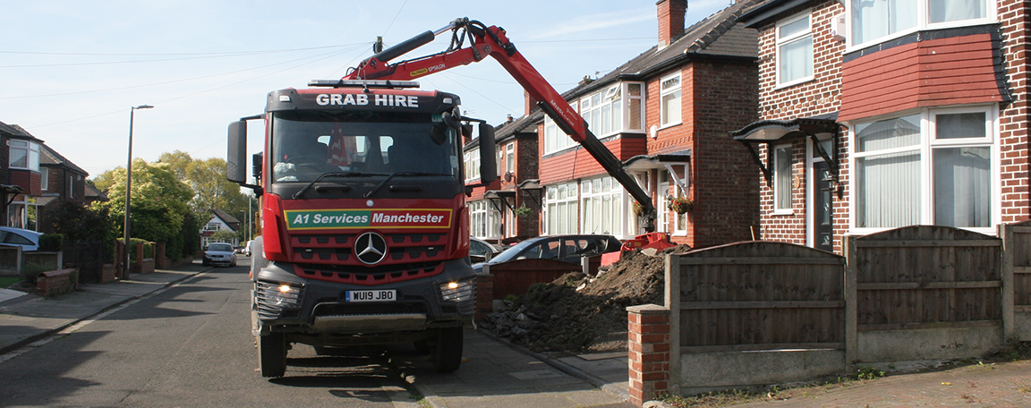 One of our grab trucks in operation removing waste soil from a domestic building project.